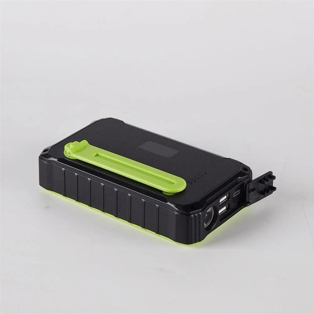 Orange and green hand solar power bank with solar panel, USB ports, and LED light showing 12000mAh capacity
