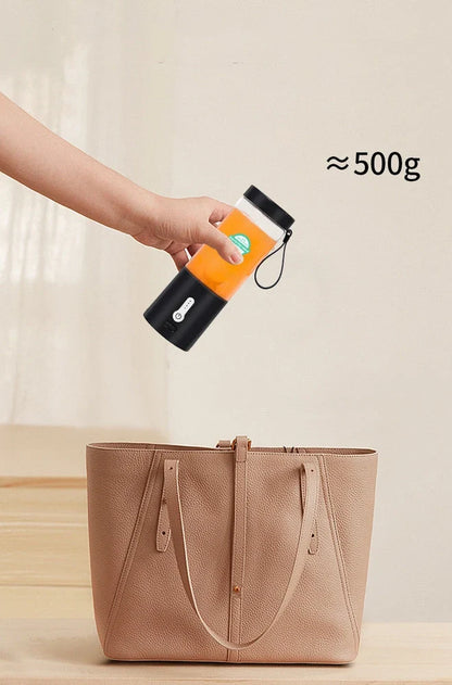 Black portable juicer with 530ml cup, USB charging port, and round feeding port for whole fruits