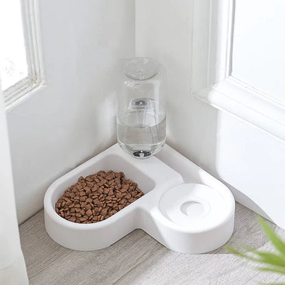 White plastic pet water fountain with pump for cats and dogs on a floor.