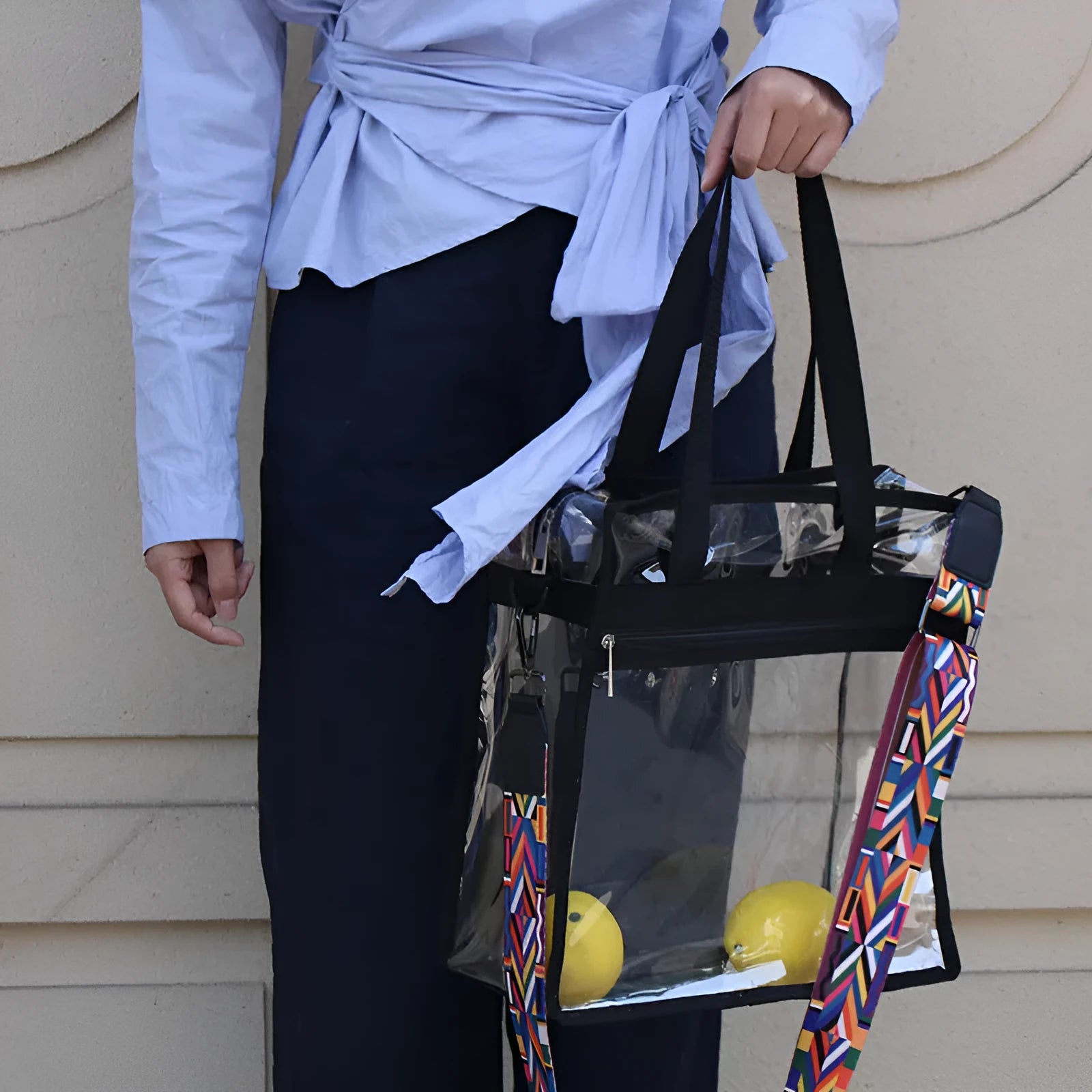 Women's PVC transparent shoulder messenger bag showing clear front panel with colour options and dual strap design