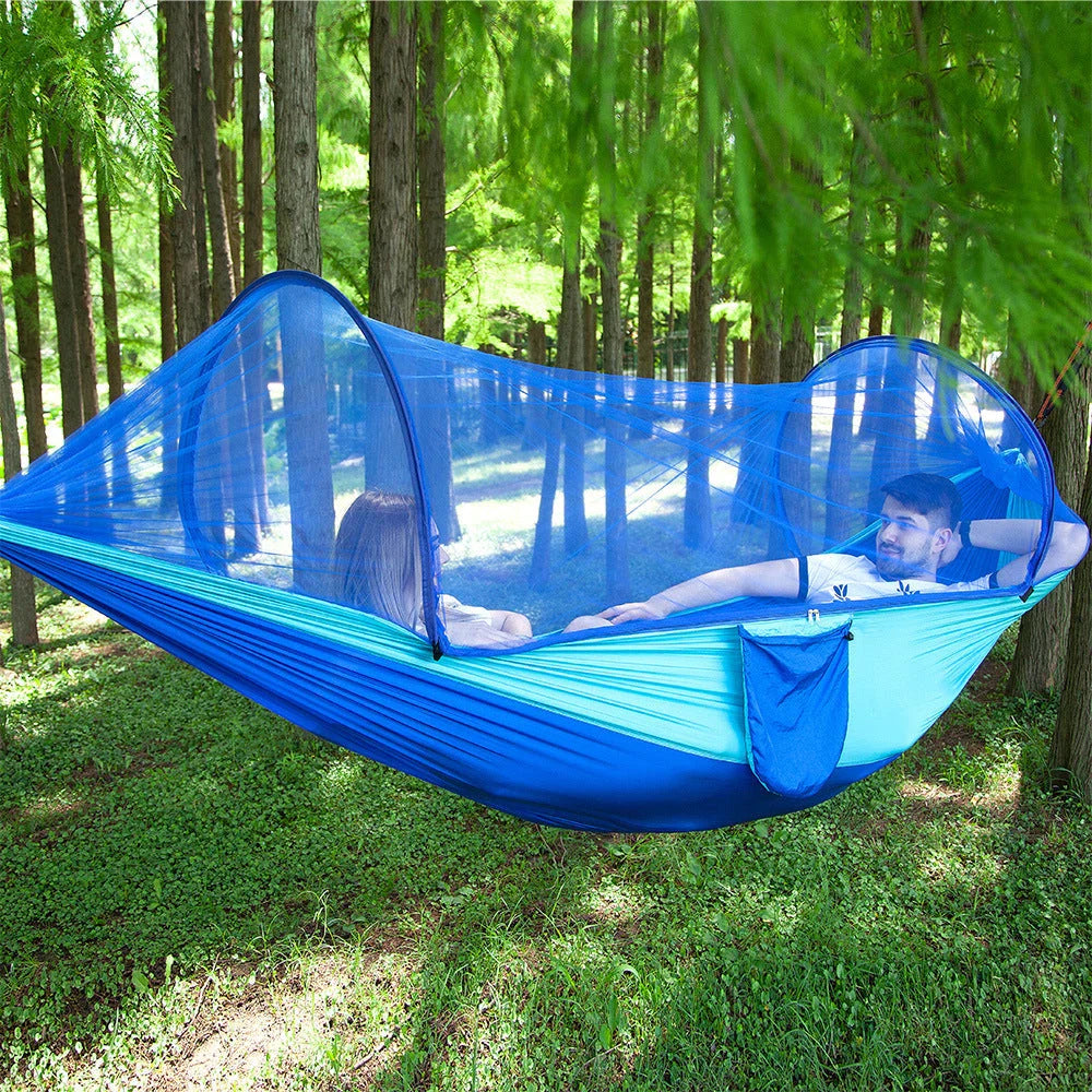 Cozy outdoor hammock with mosquito net for relaxing in nature and outdoor adventures