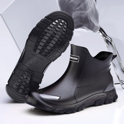 Low-cut solid colour PVC rain boot with round toe and plastic sole.