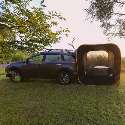Black pop-up quick-throw car tail tent unfolded to a 200cm cube, set up behind an SUV.