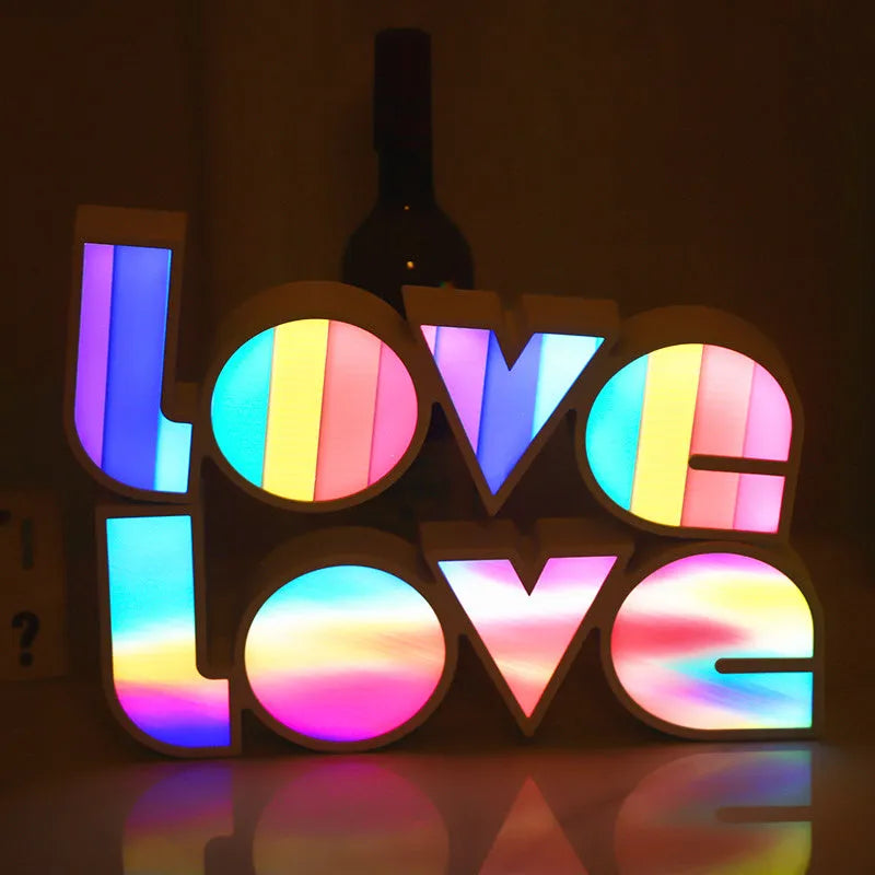 Rainbow halo LED love light with 'LOVE' word decoration on plastic casing.