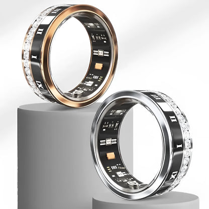 Gold and silver diamond-inlaid smart ring for blood oxygen monitoring on a finger.