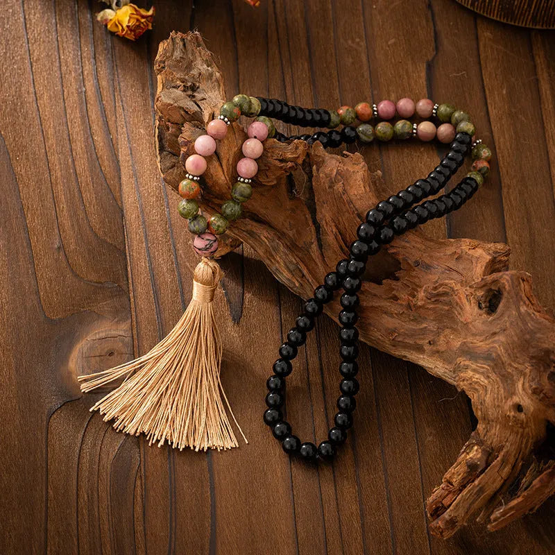 Vintage bohemian-style long beaded sweater chain with a tassel, showing necklace and bracelet lengths.