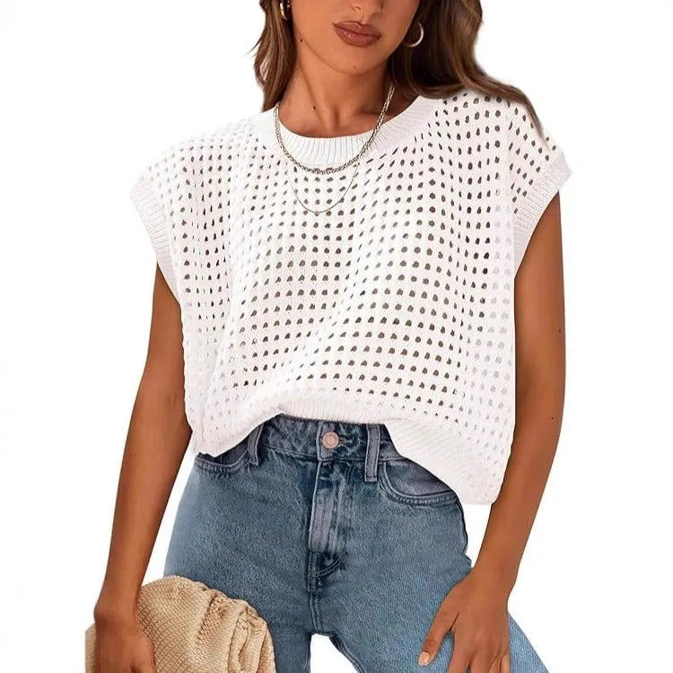White loose-fit pullover sweater with crochet cover sleeves and round neck design on hanger