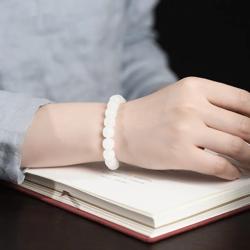 White jade barrel beads bracelet on wrist, showing Hetian jade stones in casual unisex design