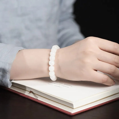 White jade barrel beads bracelet on wrist, showing Hetian jade stones in casual unisex design