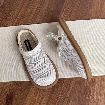 Women's beige linen slip-on shoes with mesh lining and a soft rubber sole.