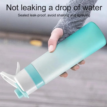 Large plastic spray water bottle with handle strap and leakproof lid in green colour.
