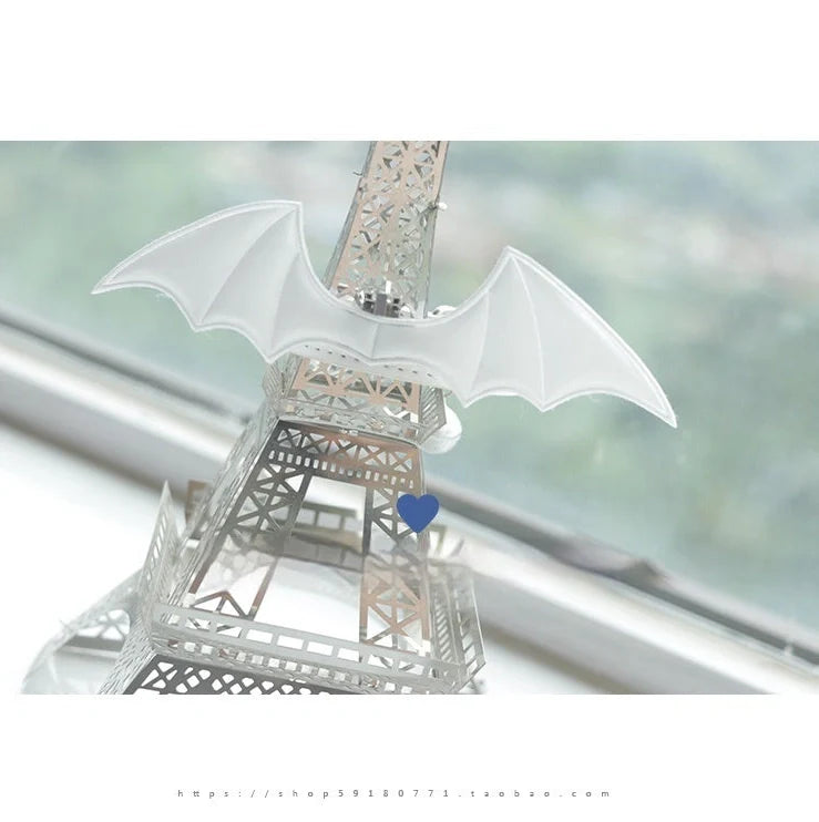 Black patent leather choker with 15cm wings decoration and bell attachment on adjustable 30-40cm collar