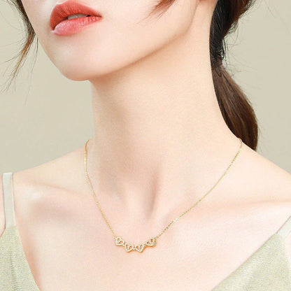 Enchanting magnetic heart-shaped four-leaf clover pendant necklace in gold, silver, and rose gold colors