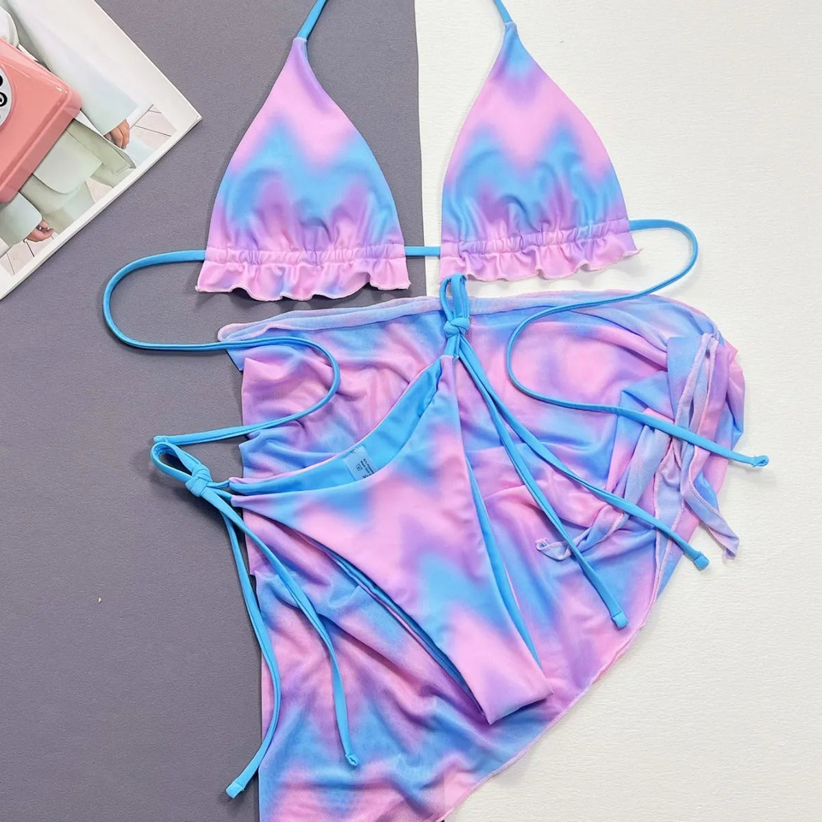 Women's split tie-dye bikini set with skirt, bra, and panties in pictured colour