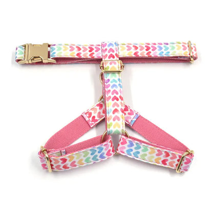 Pink colourful dog harness with heart-shaped stones and gold buckle in chest and back strap design