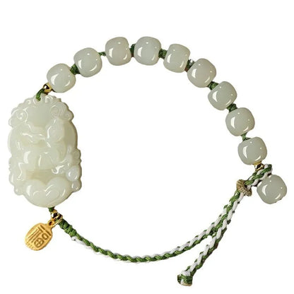Hetian jade bracelet with a rabbit zodiac charm and S925 silver card on a red ice cotton rope.