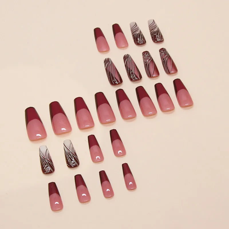 Set of 24 French line design fake nail stickers and one tube of adhesive glue on a white background.