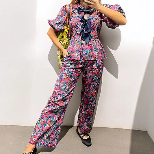 Floral print trousers suit with puff sleeves and tie-neck top in picture colour