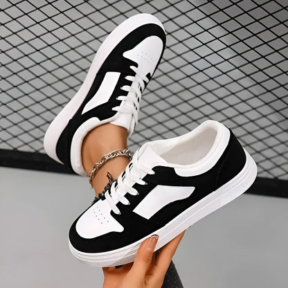 Black women's low-top lace-up casual sports shoes with a round toe and flat rubber sole.