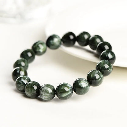 Green Dragon Crystal bracelet with 8-9mm geometry beads and Ruyi elements on wrist