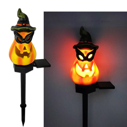 Solar-powered Halloween pumpkin lanterns lighting up a garden at night