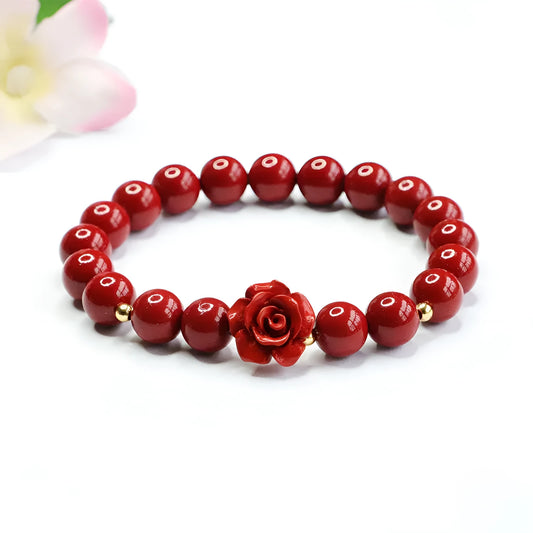 Close-up of a handmade purple gold sand cinnabar rose bracelet with an 8mm bead.