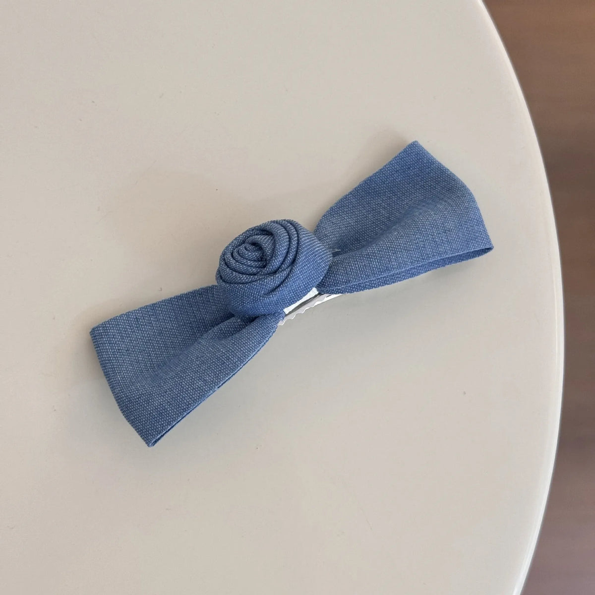 Cloth barrette hairpin set showing blue bow, beige lace, and pearl butterfly designs