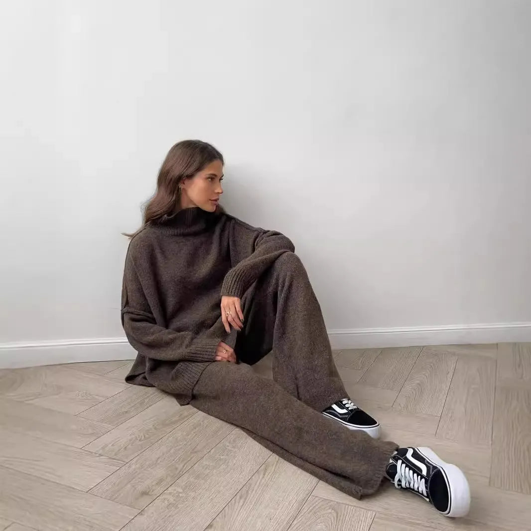 Women's acrylic side-slit sweater suit in dark grey, featuring a top and trousers for a coordinated two-piece set.