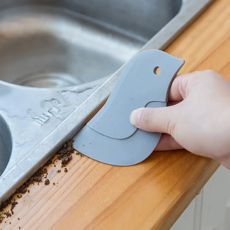 Penguin-shaped silicone kitchen scraper with soft blade for cleaning plates and pots