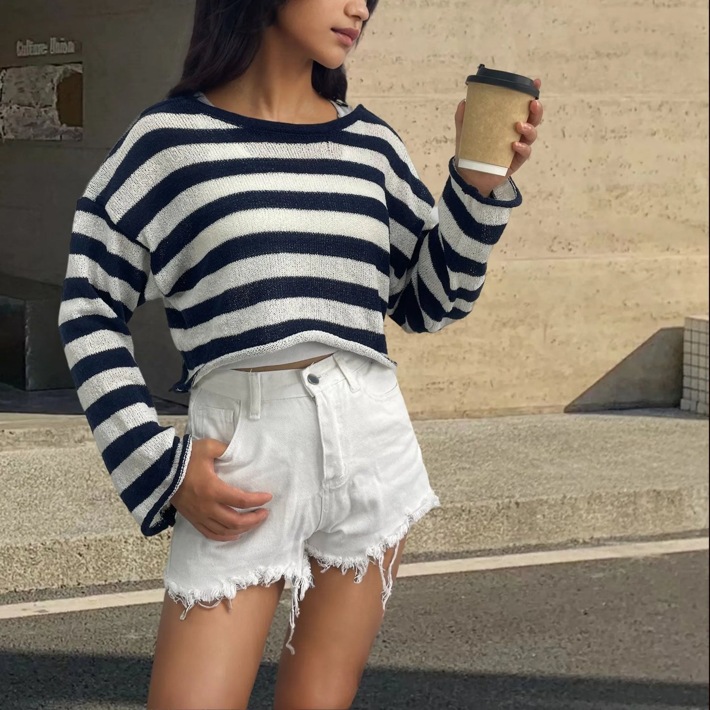 Reversible black and white striped cropped sweater shown worn both front and back.