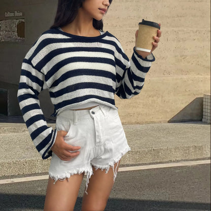 Reversible black and white striped cropped sweater shown worn both front and back.