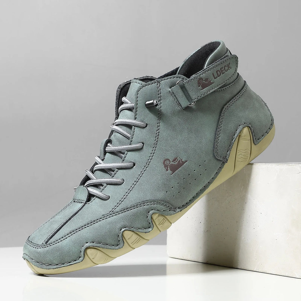 High top men's shoes in khaki with rubber soles and microfiber upper, showing round toe and middle tube height