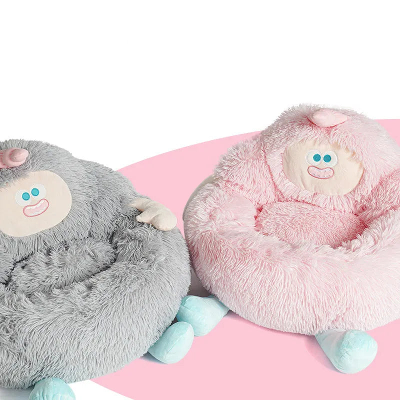 Grey plush donut-shaped pet nest bed with raised edges for a cat or dog.