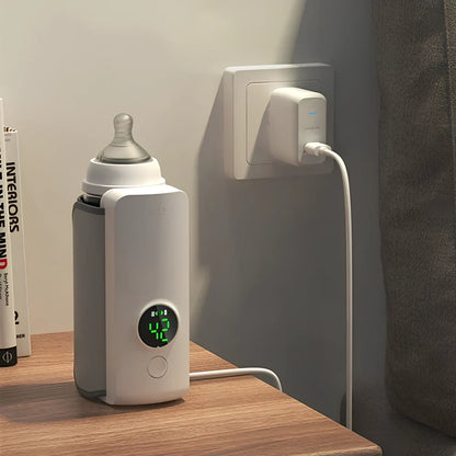 White digital display portable milk warmer with USB charger showing compact 85mm length design