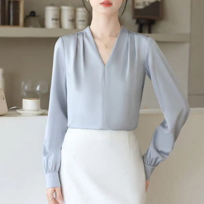 Women's blue long sleeve shirt with slim fit design and 3D stitching construction detail