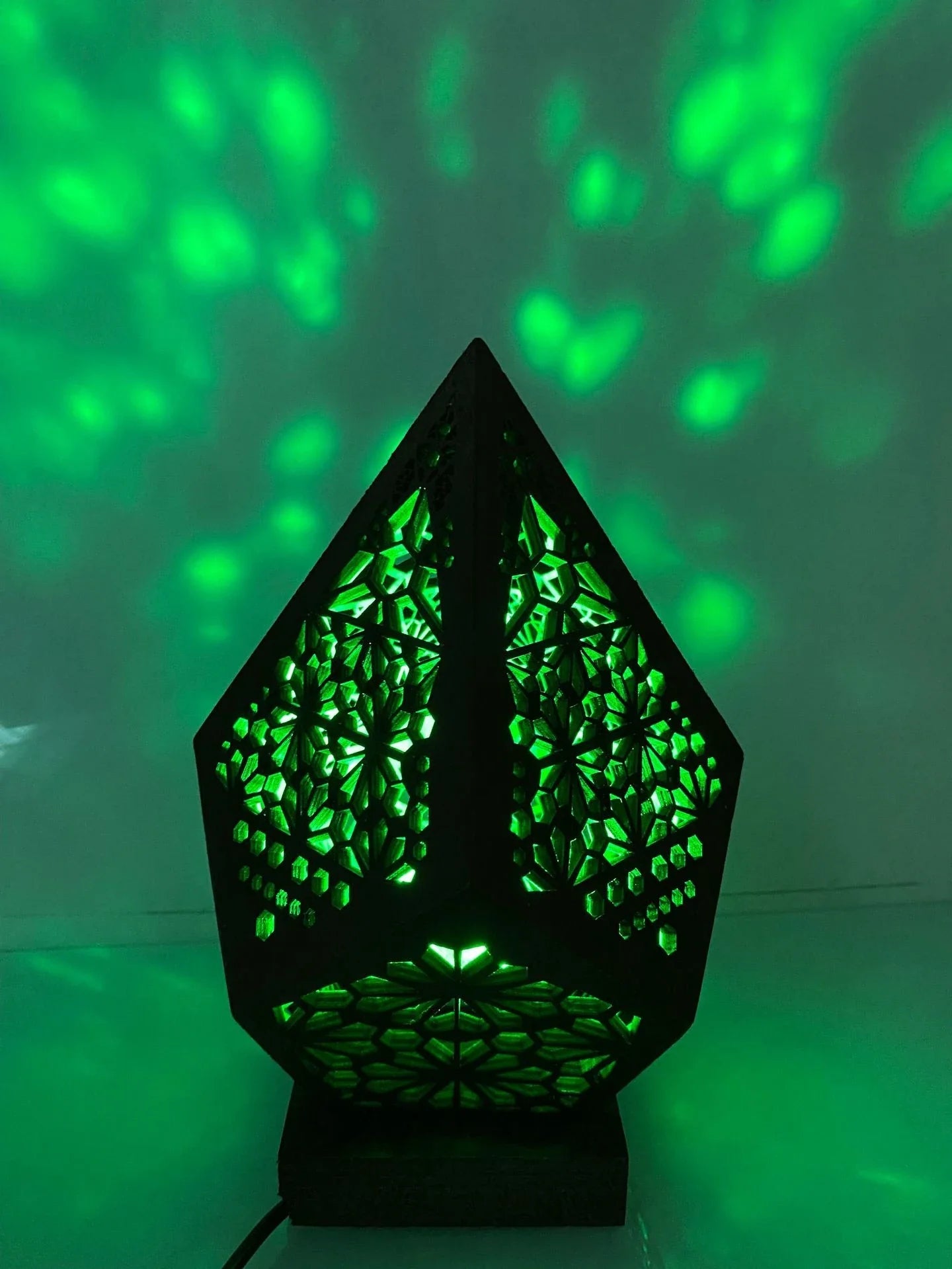 Wooden projection lamp with 3D lighting effects creating a mesmerizing atmosphere in a living room