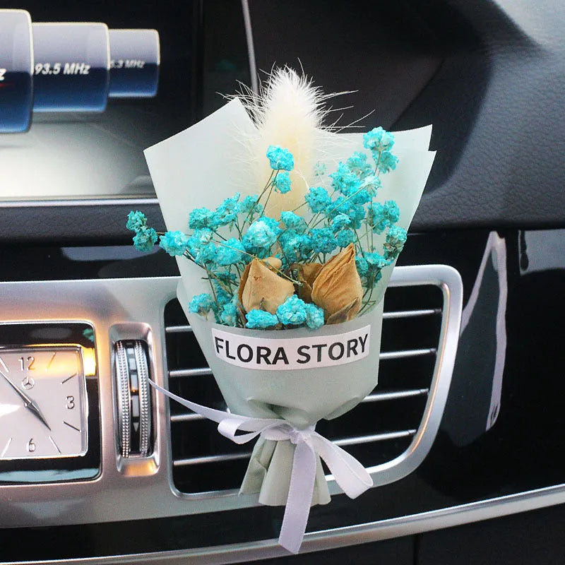 Mini dried flower bouquet mounted in car air vent for decorative aromatherapy