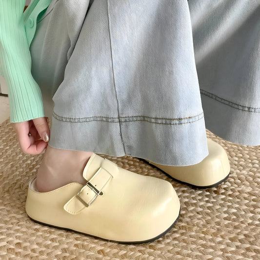 Flat buckle casual sneakers in beige, black, silver, and yellow colours, showing round toe and PU upper.