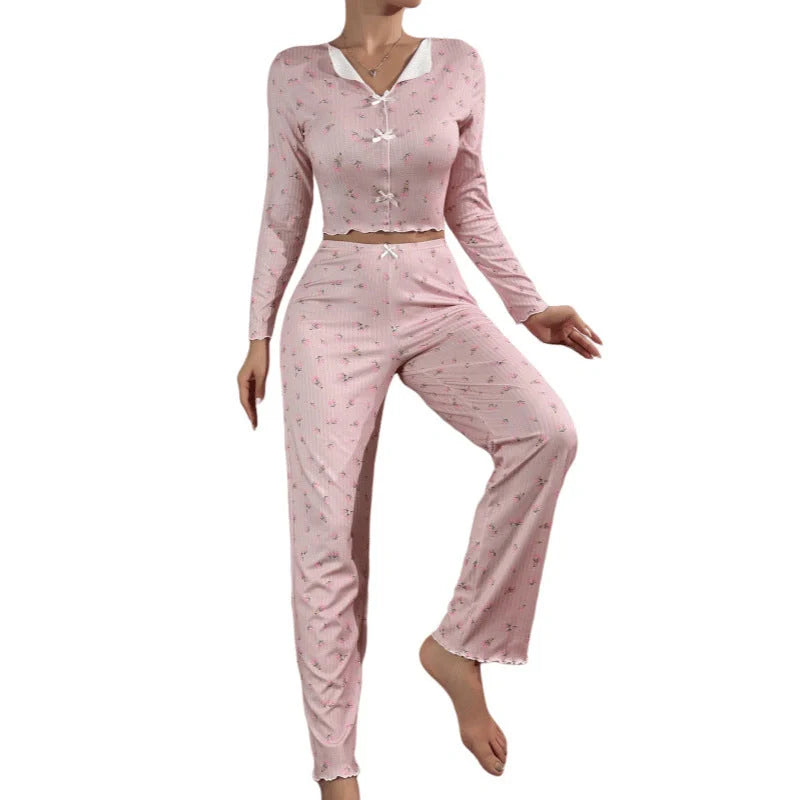 Stylish two-piece loungewear set in vibrant floral prints, featuring a long sleeve top and coordinating pants for all-season comfort and versatility.