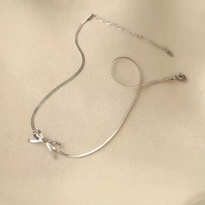 Trendy bowknot stainless steel gold plated snake chain necklace for women