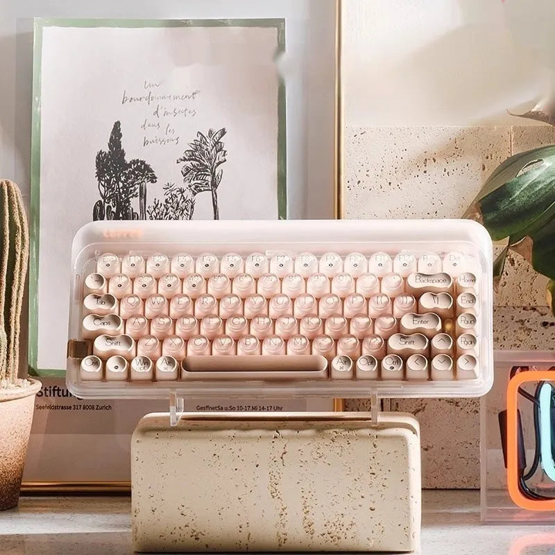 Liquid Foundation wireless mechanical keyboard with 84 keys, hot-swappable switches, Bluetooth calculator, and included mouse and light on a desk.