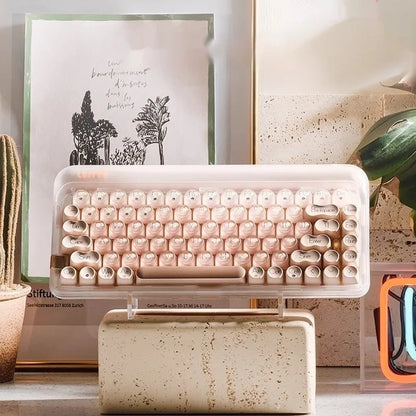 Liquid Foundation wireless mechanical keyboard with 84 keys, hot-swappable switches, Bluetooth calculator, and included mouse and light on a desk.