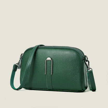 Minimalist top-grain leather crossbody bag in horizontal square shape with inner pockets, available in five colours