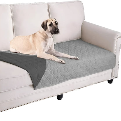 Reversible dog blanket sofa cover in burgundy and grey, laid flat on a sofa