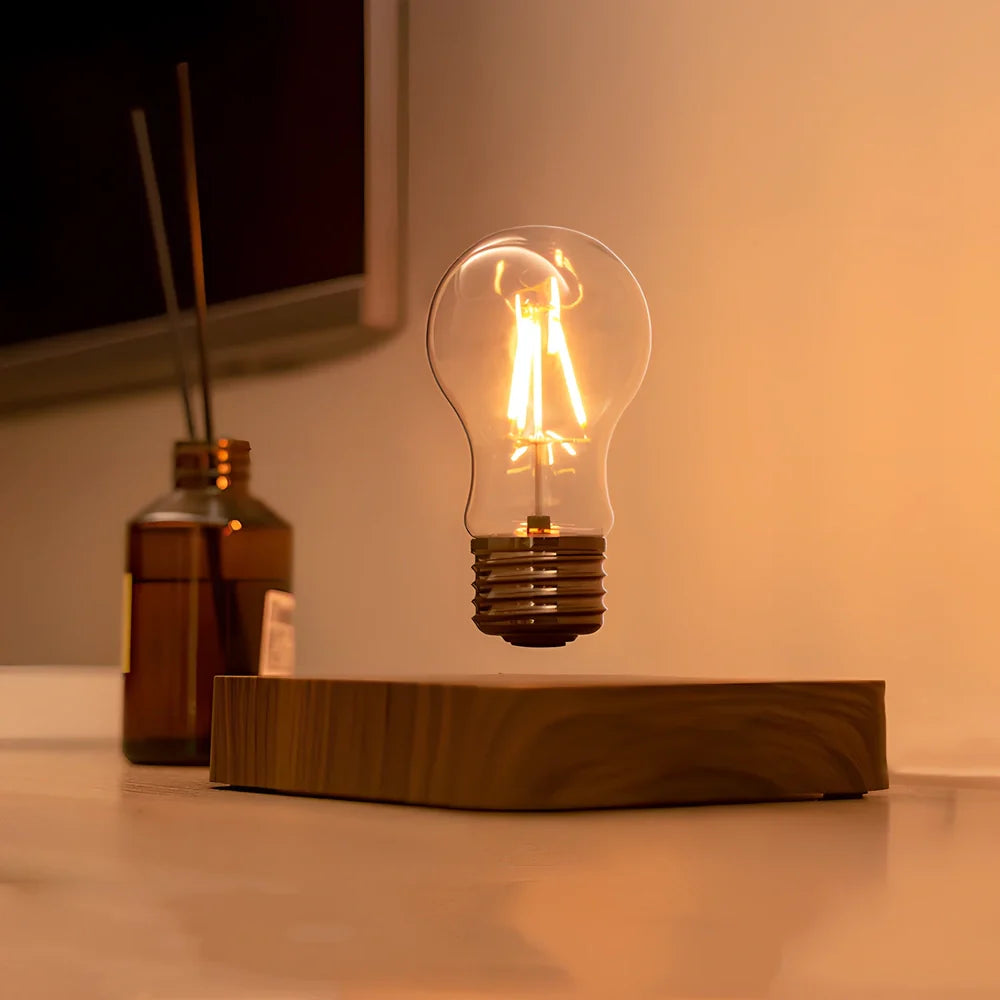 Self-rotating maglev LED bulb levitating above circular base with warm yellow illumination