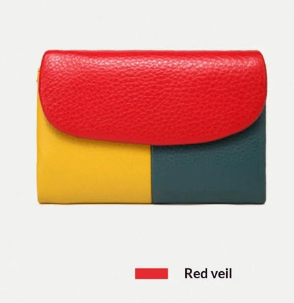 Women's short wallet in soft leather texture with solid colour and stitching detail, urban minimalist style