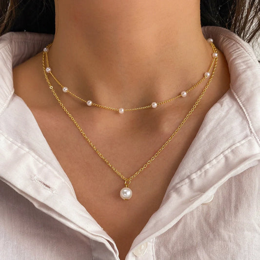 Women's gold double-layer pearl tassel necklace with elegant pearl inlay