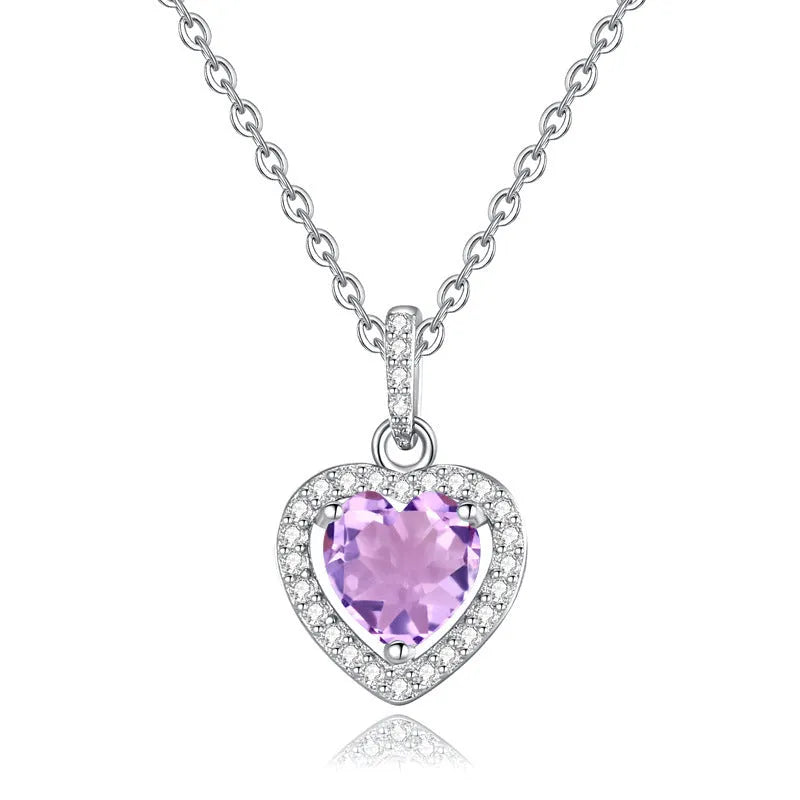 Sterling silver heart pendant necklace with a coloured gemstone on an adjustable chain.