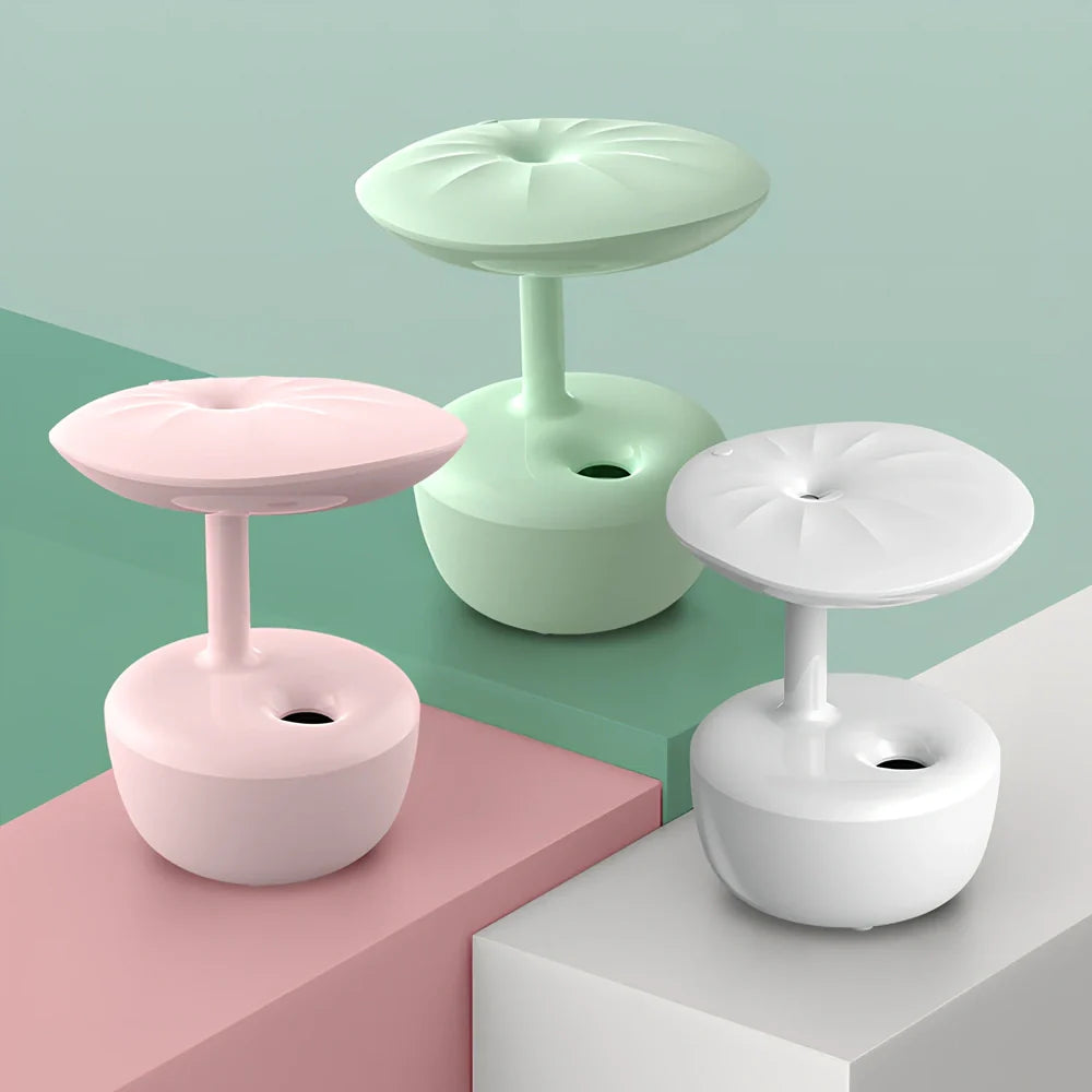 White lotus leaf shaped USB humidifier with mist output and LED illumination on wooden surface