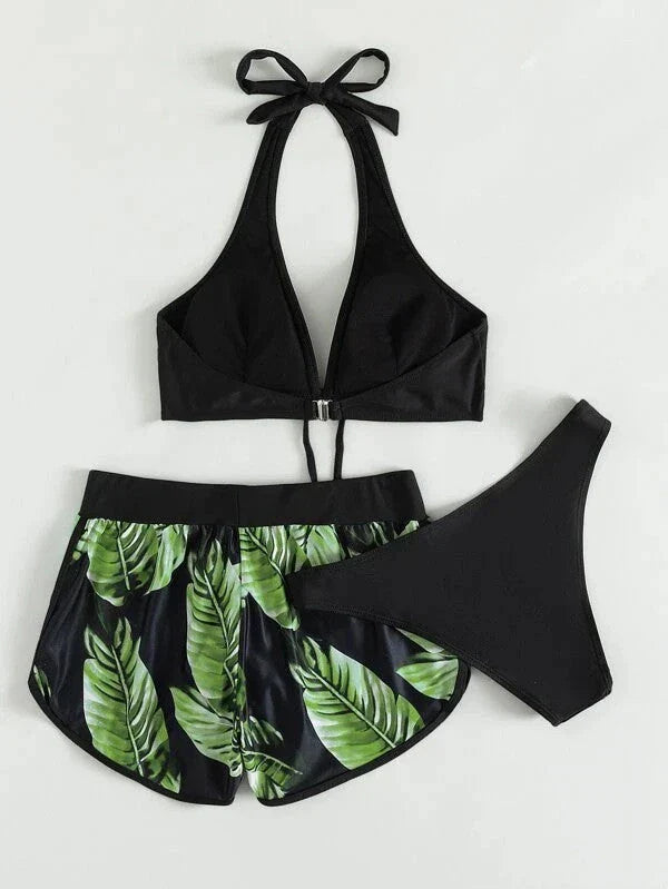 A stylish 3-piece swimsuit set featuring a unique leaf print design, including a top, bottoms, and matching shorts.